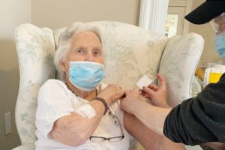 100 year old Vietta McInnes recieves her first vaccination at Sharbot Lake Retirement & Retreat.